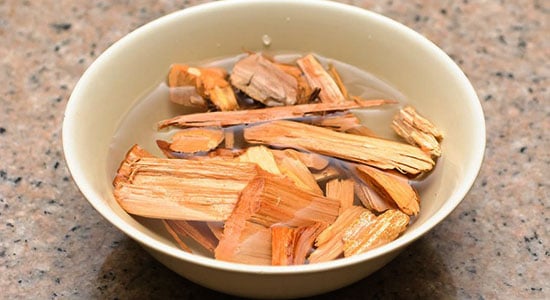 Place wood chips into a bowl filled with water