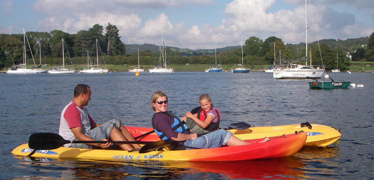 Family canoeing on Windermere copyright Windermere Canoe and Kayak